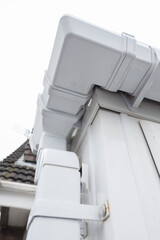 Cleaned white plastic pvc gutters and drain pipes that were blocked and full of green mould on the...