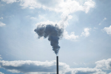 Smoke from the factory chimney, blue sky with clouds and industry fog, background for template, no...