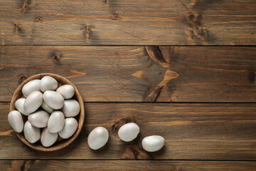 Obraz na płótnie Canvas Raw jackfruit seeds on wooden table, flat lay. Space for text