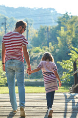 Daughter and father enjoying outdoors nature.