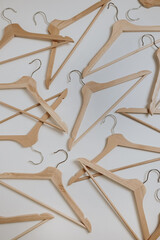 Hangers for clothes on white background. Minimal shopping, store, sale background.