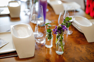 Elegant decorated table for dinner with family or friends. Fine dining at home during corona virus quarantine lockdown.