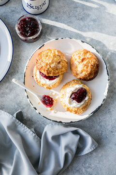 Traditional British Scones with clotted cream, raspberry jam.