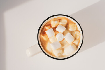 Coffee cup with marshmallow. Closeup, top view, copy space. Sunny atmospheric morning minimalistic...