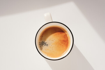 Hot coffee cup. Sunny morning atmospheric minimalistic concept