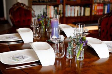 Elegant decorated table for dinner with family or friends. Fine dining at home during corona virus quarantine lockdown.
