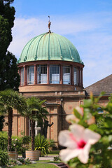 View at the Orangery of the State Art Gallery with hibiscus flower in front in bokeh (Karlsruhe,...