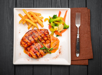 Grilled chicken breast steak with vegetables