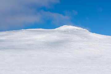Snow covered mountain with sunlight and shadows.Shot in Sweden, Scandinavia