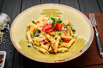 Tomato and Bacon Penne Pasta on a wooden table