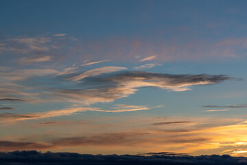 Cloud formation in warm colors at dusk. Shot in Sweden, Scandinavia.