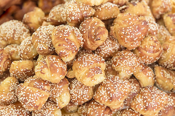 Freshly oriental buns with sesame. The regional traditional cuisine of Israel. Travel photo