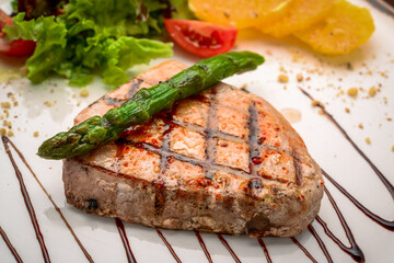 Grilled steak and asparagus on a plate
