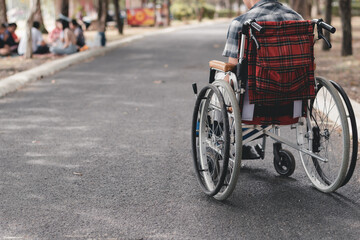 Asian special child on wheelchair learn how to use wheelchairs on street like normal people in the city, Lifestyle in the education age of disabled children,Happy disabled kid concept, Vintage tone.