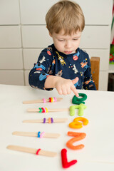 logic and counting game for early education. Stuffed felt numbers and Popsicle Sticks with hair tie gum on it. Each popsicle have dedicated number of ring.