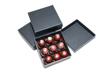 Chocolate candies in giftboxes isolated on white background. Assorted chocolates confectionery in their gift boxes. Set of colorful chocolate bonbons.