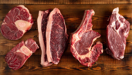 pieces of meat of different types on the board. beef. top view.