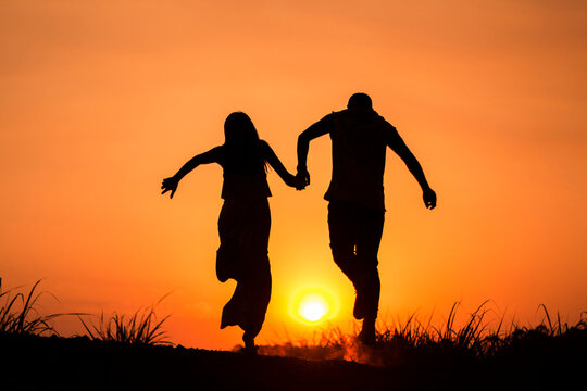 couple at sunset silhouette