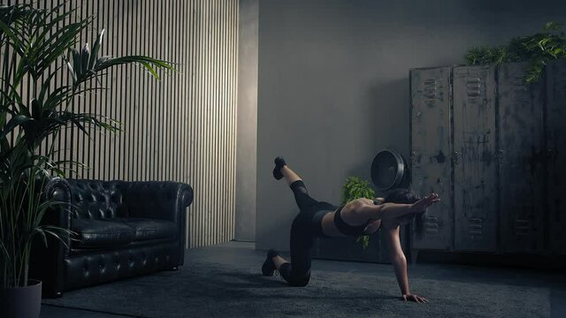 Athletic young woman training bird dog at home in sportswear.Slow motion.