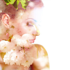 Beautiful young woman with spring blooming cherry tree flowers, double exposure. Beauty treatment, youth, springtime concept