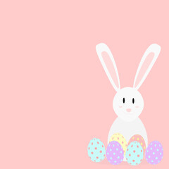 white rabbit next to easter eggs on pink background