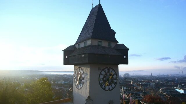 The famous clock tower on Schlossberg hill, one of the city of Graz attractions, Styria region, Austria, in the morning