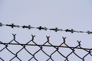 Fence wire photographed outdoors in the best of daylight