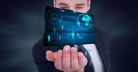 Composition of network of digital icons with globe on digital screen over hand of businessman