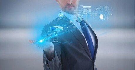 Composition of network of digital icons and data processing over hand of businessman