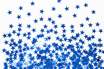 Christmas background with blue star confetti. Holiday background for New Year