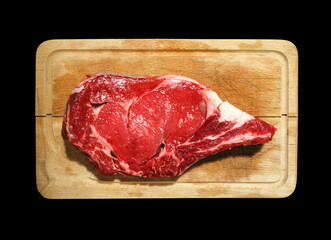 Beef prime rib on a cutting board