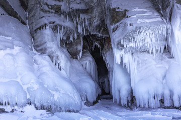 Ice cave, Icicles in the rocky caves, Lake Baikal in winter, Siberia