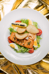 grilled salmon with salad and seafood