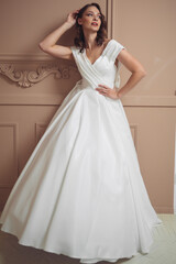 Fototapeta premium Beautiful bridesmaid dress earrings. Beautiful bride with stylish makeup and hairstyle.