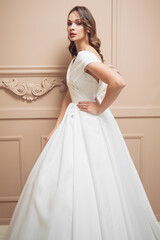 Fototapeta premium Beautiful bridesmaid dress earrings. Beautiful bride with stylish makeup and hairstyle.