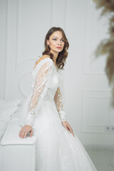 Fototapeta premium portrait of beautiful blonde bride with fashion hairstyle and make-up