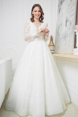 Beautiful bridesmaid dress earrings. Beautiful bride with stylish makeup and hairstyle.