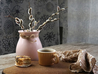 breakfast with cake and coffee and sprigs of verta on the table