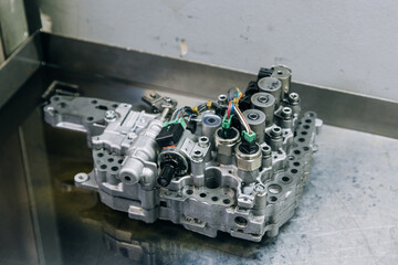 Set of various engine and gearbox spare parts. Shiny gears for planetary gearbox.Metal autotechnology background. wheel engine gears, close up. Automatic transmission in section