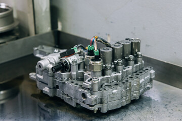 Set of various engine and gearbox spare parts. Shiny gears for planetary gearbox.Metal autotechnology background. wheel engine gears, close up. Automatic transmission in section