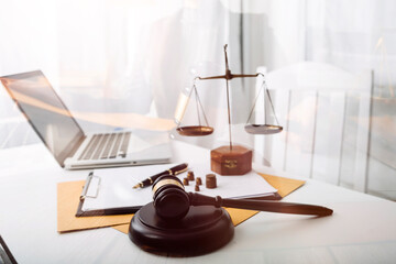 justice and law concept.Male judge in a courtroom on wooden table and Counselor or Male lawyer...