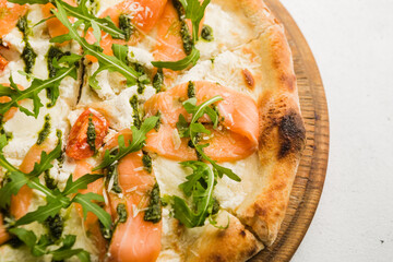 pizza with arugula and salmon