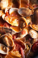 Seafood sauce, close-up. Vongole with tomatoes.