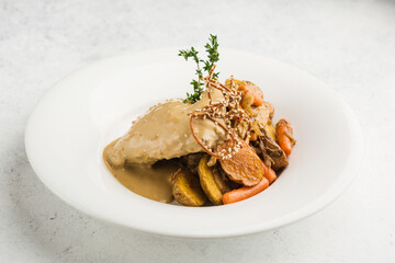 rabbit leg stewed in sour cream with carrots