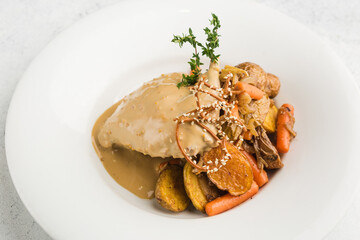 rabbit leg stewed in sour cream with carrots