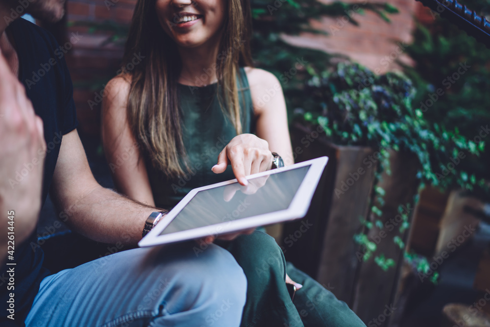 Poster unrecognizable male and female bloggers discussing mock up content publication form blank touch pad 