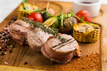 restaurant dish with grilled meat and vegetable side dish