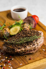 restaurant dish with grilled meat and vegetable side dish