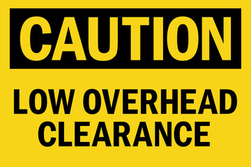 Caution low overhead clearance sign. Black on yellow background. Safety signs and symbols.