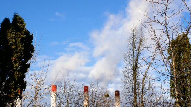 Smoke from the chimney of the plant. Smoke and air pollution Chimney with smoke industry. Smoke emissions from the chimney into the open atmosphere. Environmental pollution..